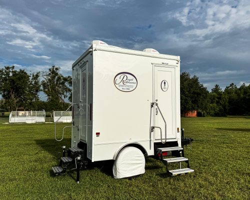 IMG_0052. 2 STALL COMPACT SEE BOTH WOMENS_S & MEN_S DOORS W_WHEEL COVER
