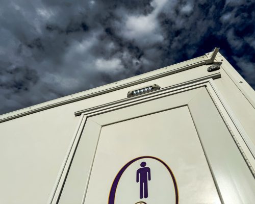 IMG_0121.2 STALL COMPACT MEN_S DOOR DETAIL ANGLE W_SKY